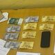 Фото пресс-службы МВД. Иностранец дал 10 тысяч сомов патрульному в здании УПСМ